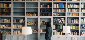 woman in front of book shelf